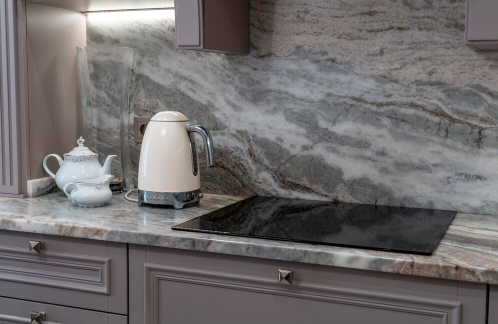 Interior of a kitchen after a granite countertop installation.