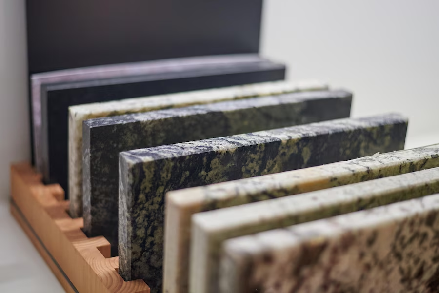 Granite slabs in a showroom, representing the importance of choosing the right material for granite countertop installation.