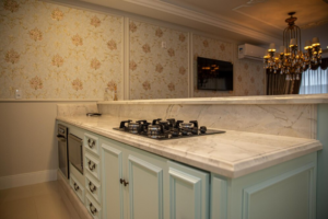 Kitchen countertop with cabinets, representing the importance of marble countertop maintenance.