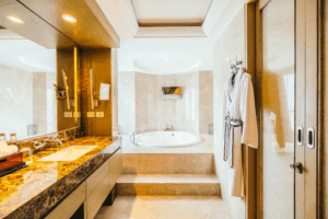 Fancy bathroom with tub surrounds.
